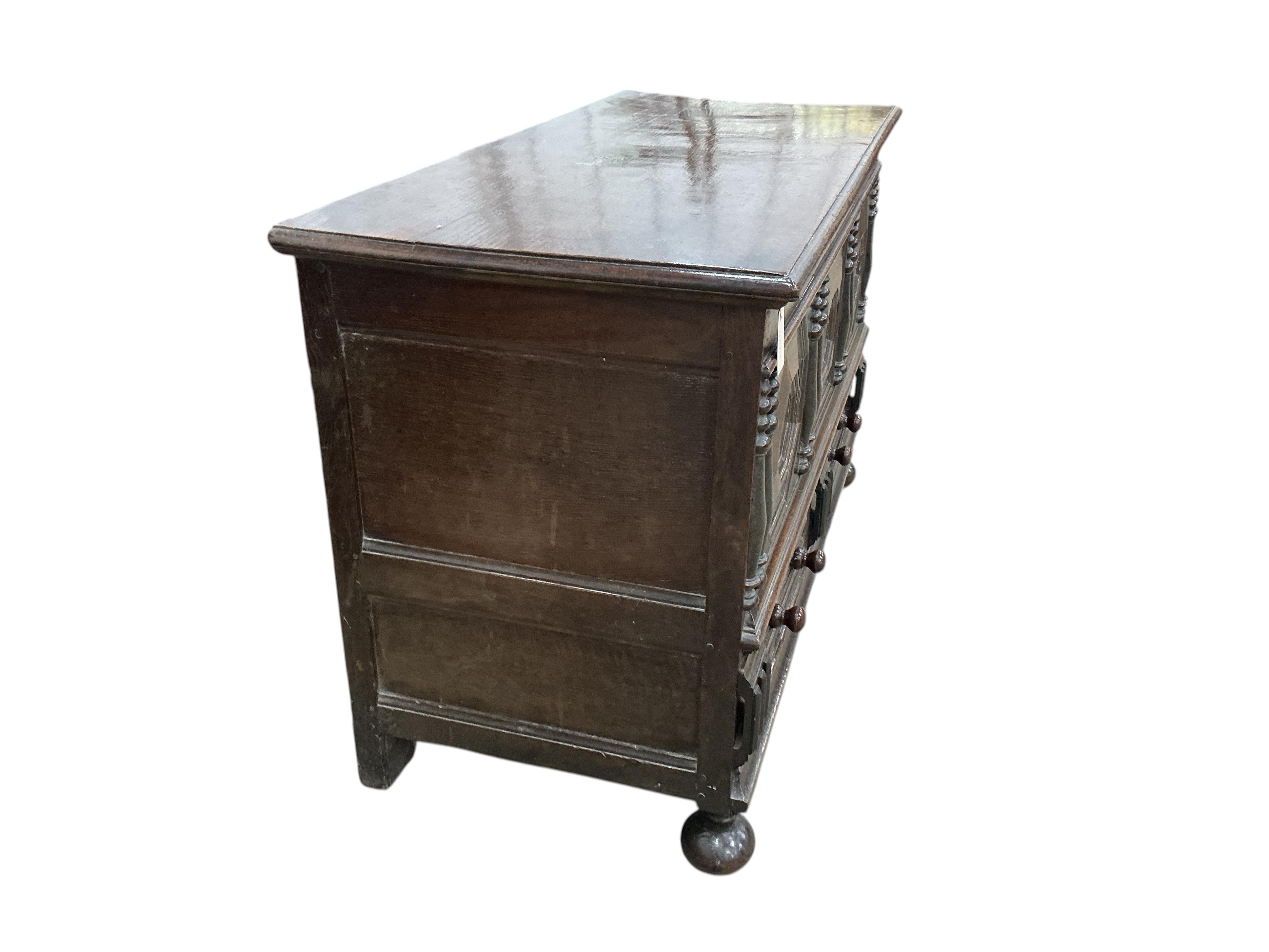 An 18th century panelled oak mule chest, carved with the initials M D, width 129cm, depth 57cm, height 83cm